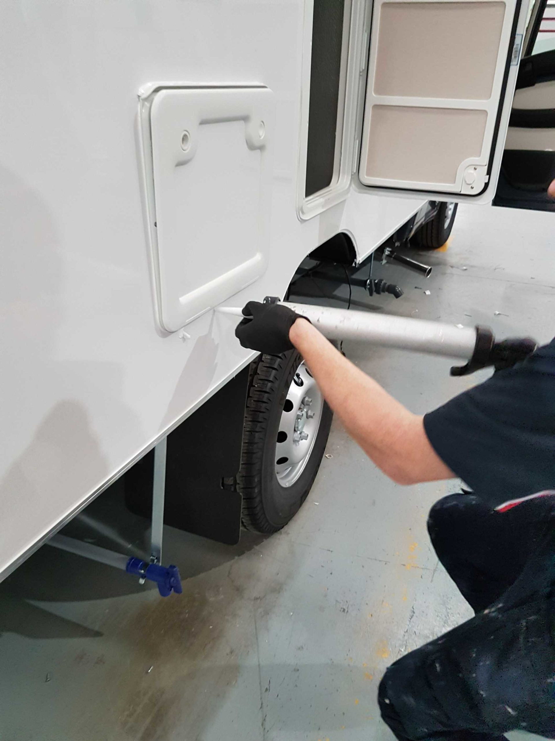 Operative applying adhesive to a substrate