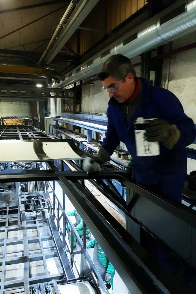 Operator applying primer