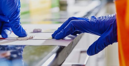 Applying adhesive to test material to ensure the adhesive bonds effectively